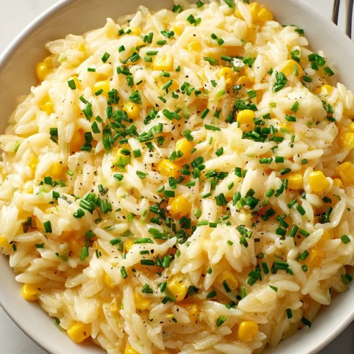 Creamy Corn Orzo: A warm bowl of comforting pasta, cheesy and herbaceous aroma.