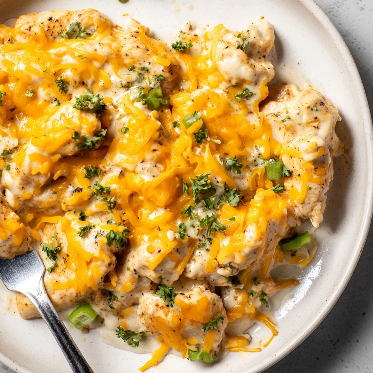 Tender Cheesy Ranch Chicken Bites topped with melted cheese, perfect for game day snacks.