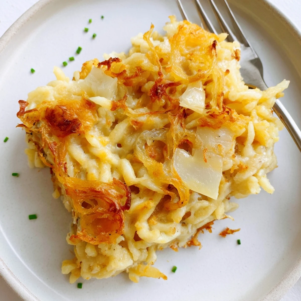 Cheesy Spaetzle Bake with golden crust, layered noodles, and creamy melted cheese.  