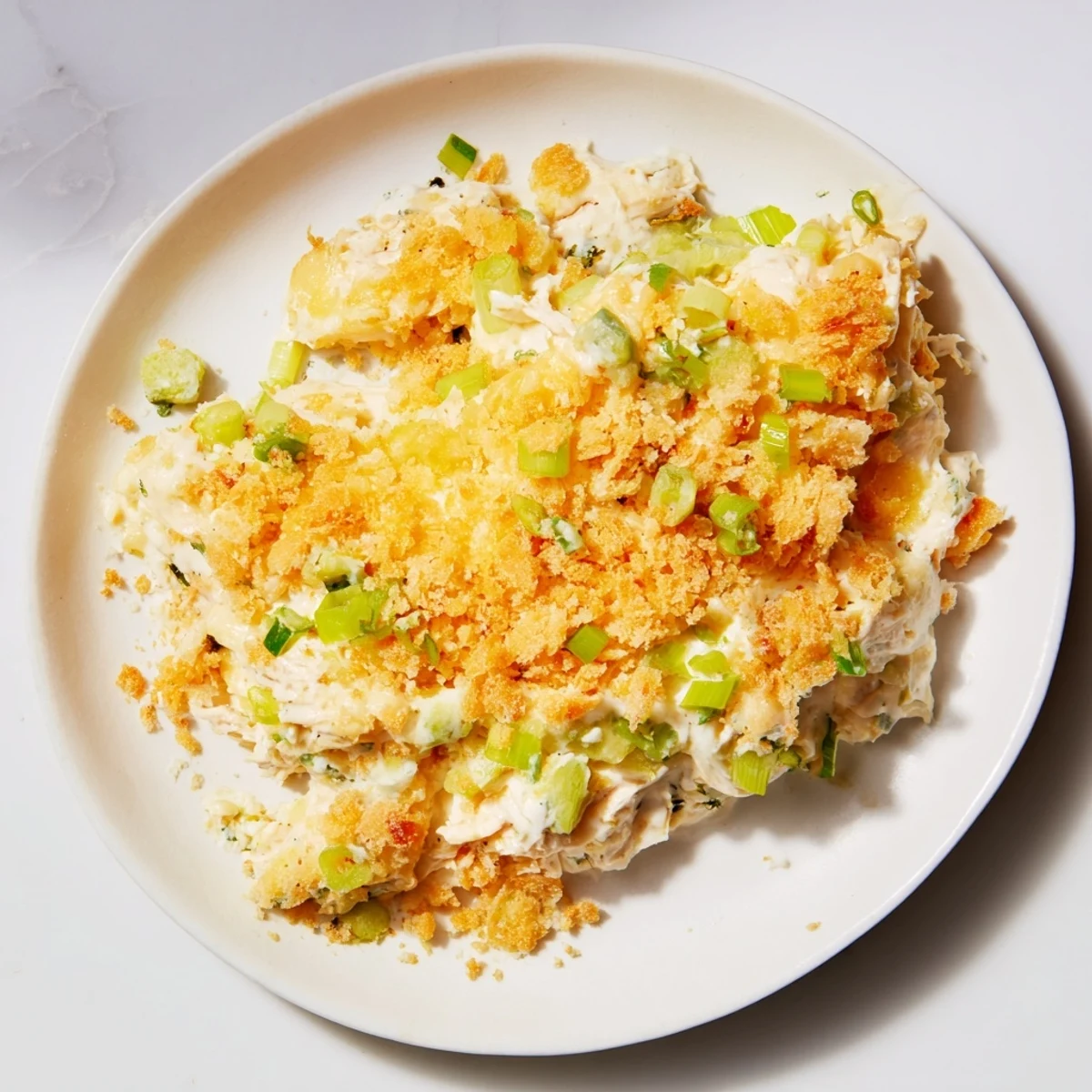 Golden-brown Neiman Marcus-Style Chicken Casserole with a buttery, crispy cracker topping, ready to serve.