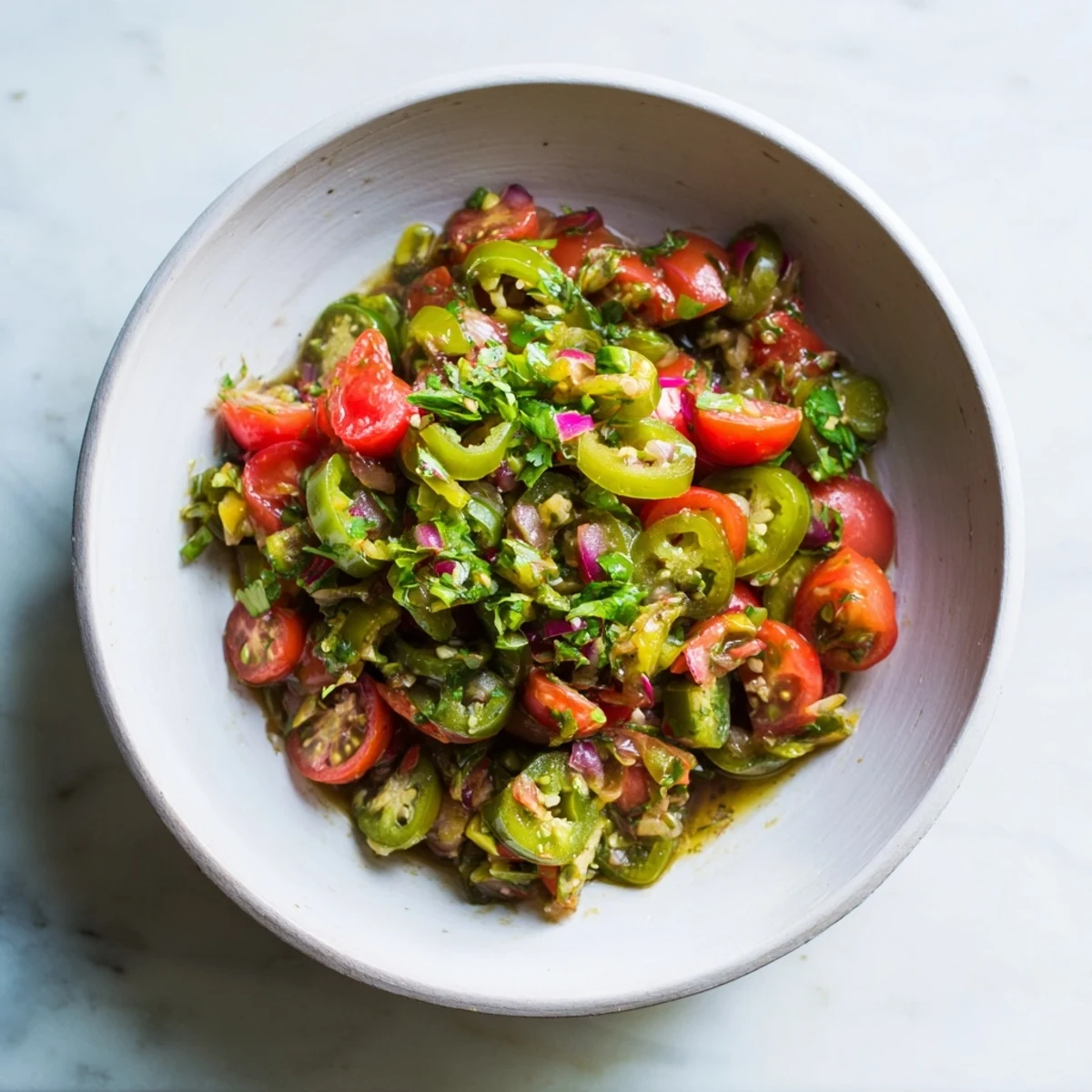 Enjoy the refreshing flavors of Pickle De Gallo Salsa drizzled over tacos, a perfect appetizer.