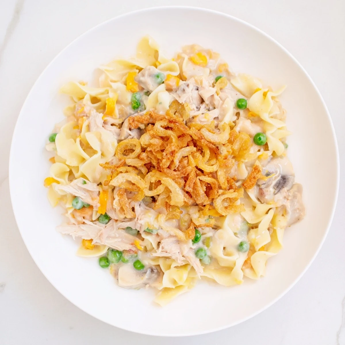 A close-up of a bubbling creamy tuna noodle casserole just out of the oven, ready to serve.