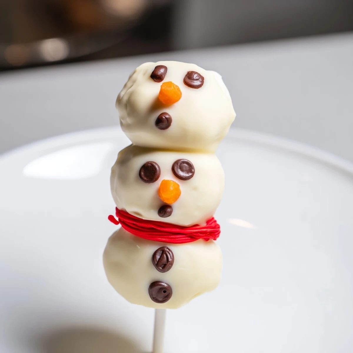 Festive Express Snowman Marshmallow Pops, dipped in white chocolate, ready for a winter treat.