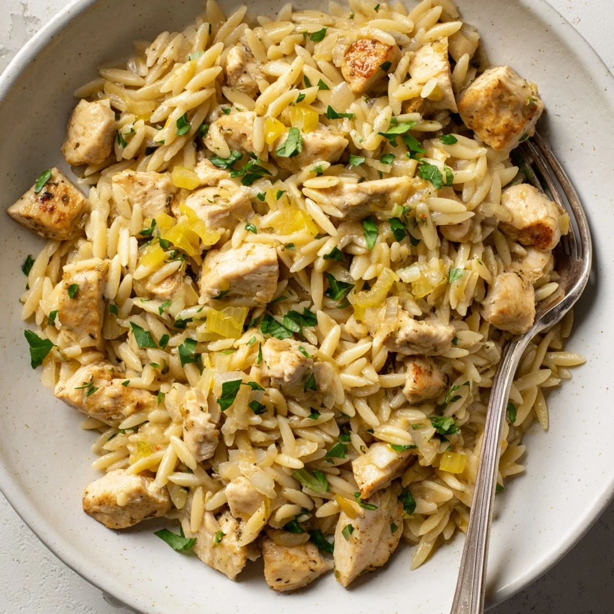 One-Pot Cajun Chicken Alfredo Orzo, a creamy, savory pasta dish with flavorful chicken and sauce.