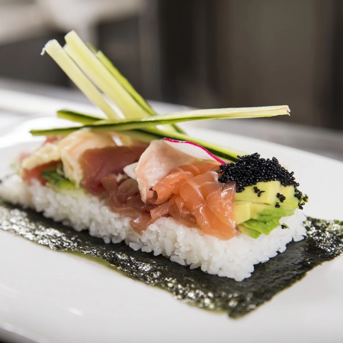 Fresh fish and vibrant vegetables form this delightful sushi sailboat appetizer, ready to serve.