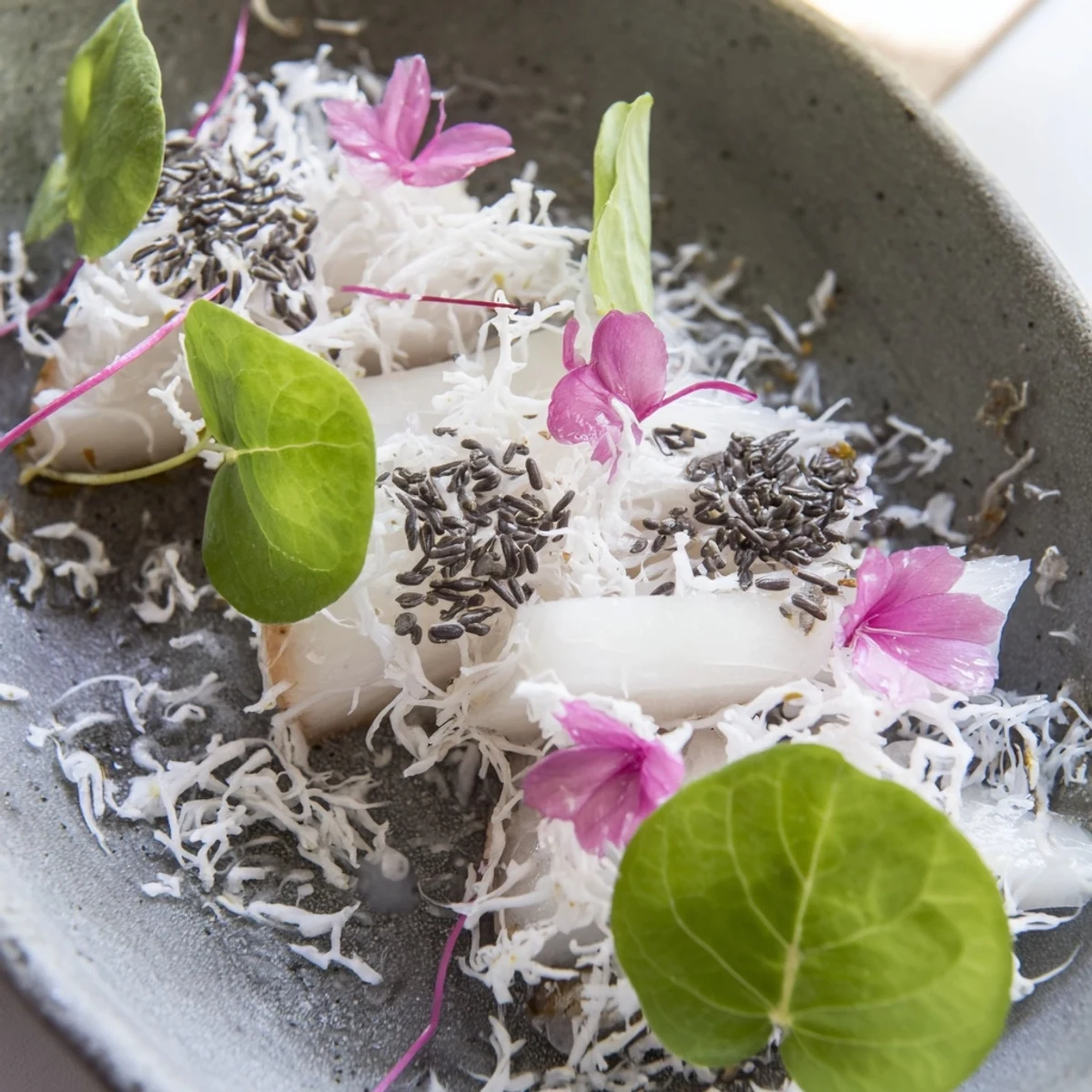 Chilled The Tundra Trek, an artistic salad, featuring pale vegetables scattered like tundra landscape.