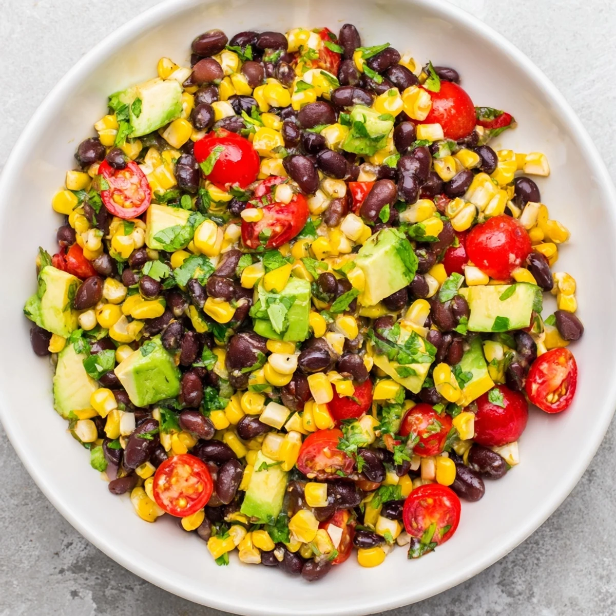 Fresh, vibrant Southwestern Black Bean and Corn Salad featuring sweet corn and spicy jalapeños, ideal as a side.
