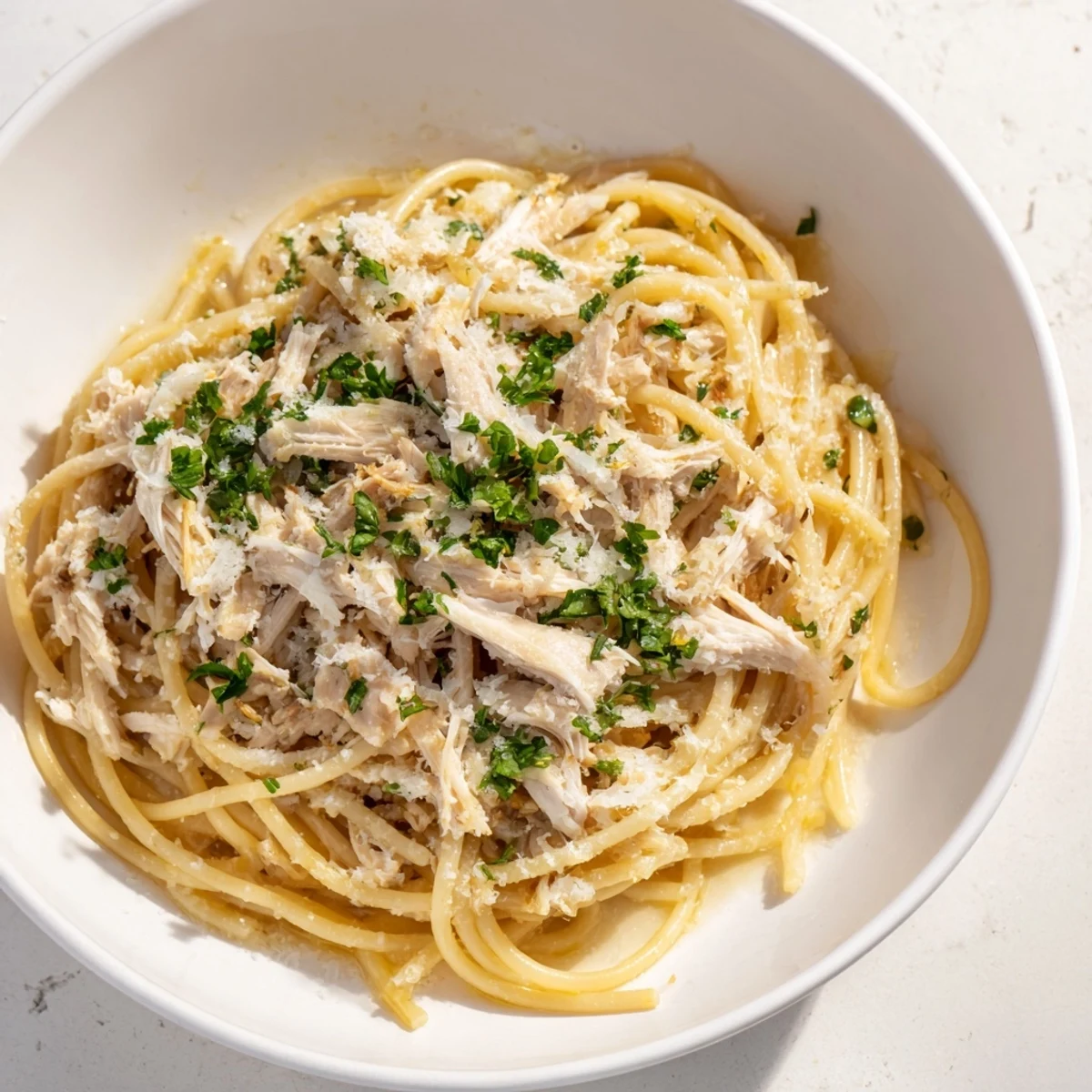 A close-up of Simple Garlic Butter Bucatini, where fragrant garlic and tender chicken star.