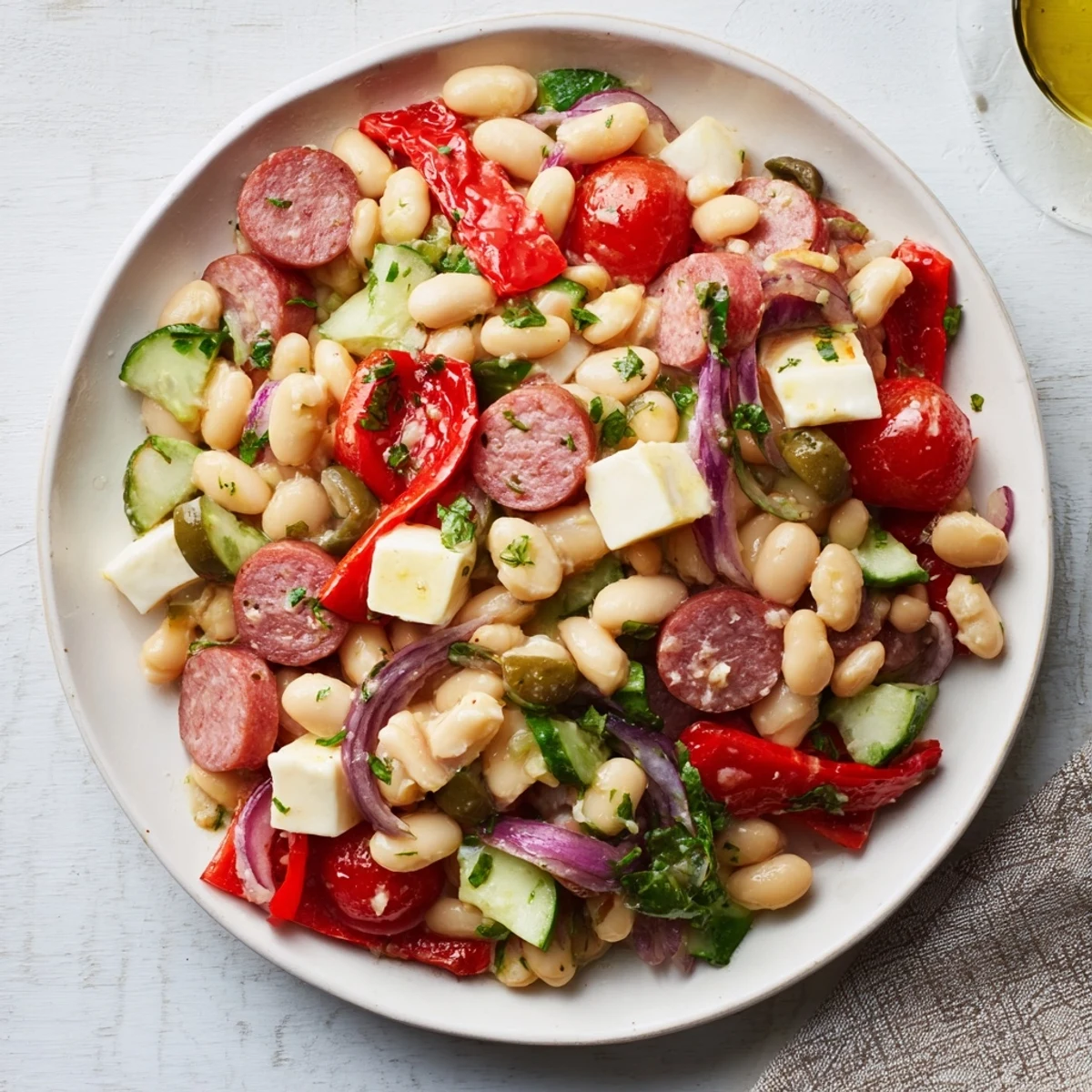 Vibrant Italian Antipasto Bean Salad, bursting with fresh tomatoes and herbs, perfect for lunch.