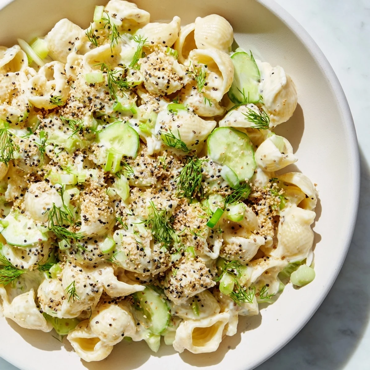 Cucumber Crunch Pasta Salad with vibrant cucumbers and herbs ready for a summer picnic.
