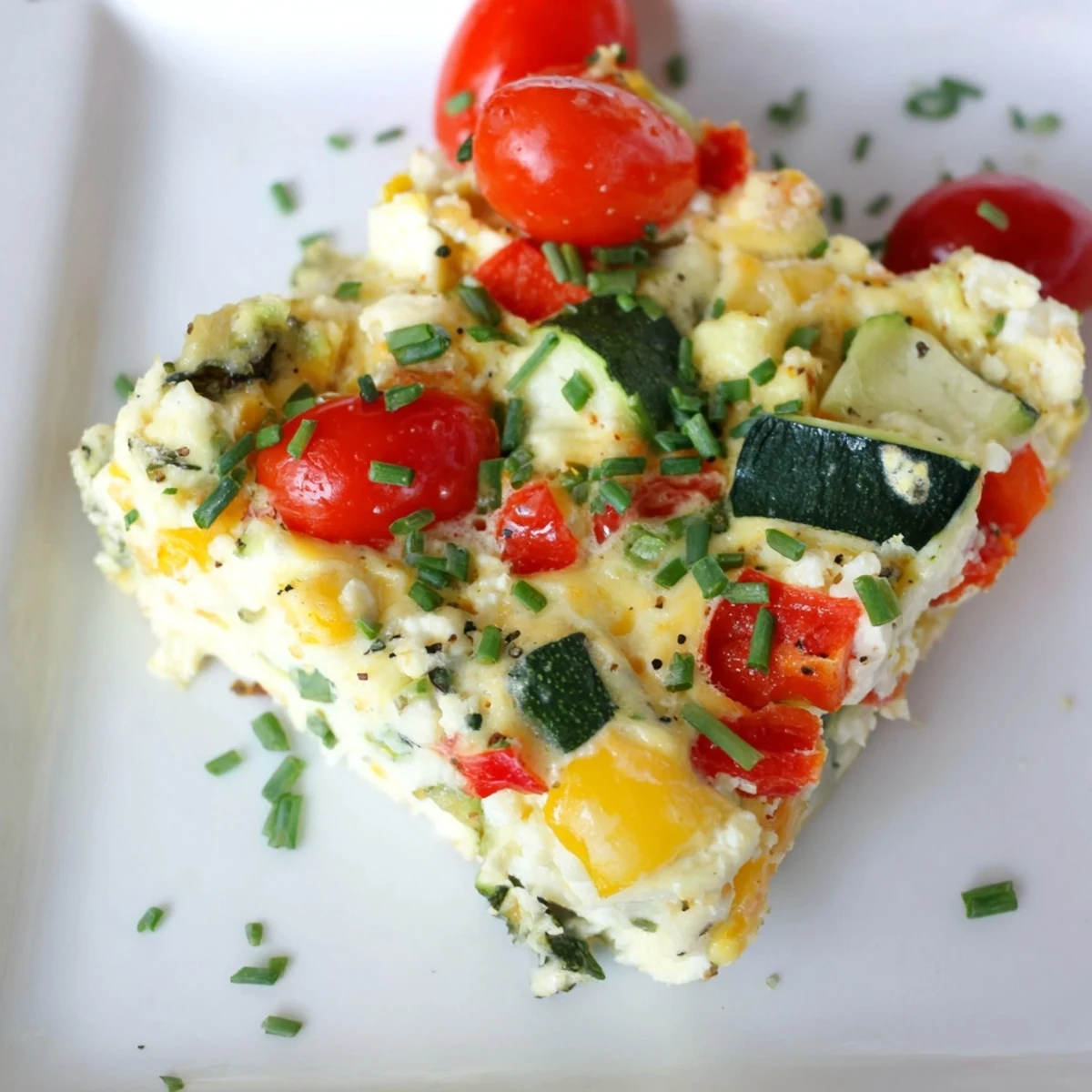 Freshly baked High-Protein Sheet Pan Eggs with Cottage Cheese and Veggies, featuring golden edges and colorful roasted vegetables.  