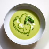 Creamy green Courgette, Pea and Pesto Soup served hot, perfect for a light spring lunch.