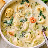 Spoon-ready Italian-American Easy Tortellini Soup With Chicken Broth in a rustic bowl, garnished with parsley and Parmesan.  