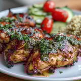 Lemon Vinaigrette Grilled Chicken and Veggie Bowl with quinoa, fresh spinach, cherry tomatoes, and feta, drizzled with zesty lemon dressing.