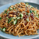 Creamy Cold Peanut Sesame Noodles with crisp cucumber, a refreshing light meal.
