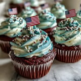 Patriotic Star-Spangled Banner Cupcakes perfect for July 4th dessert with edible flags.
