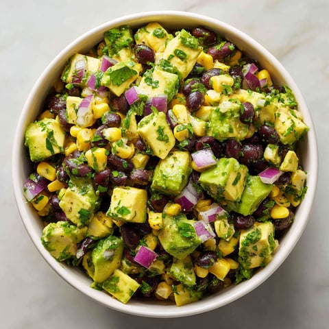 A bowl of food with a variety of ingredients.