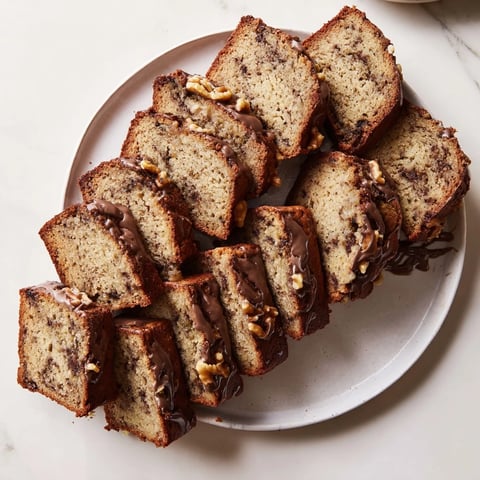 Moist coffee cream banana bread topped with walnuts, perfect for breakfast enjoyment.  
