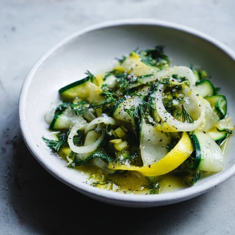 Crisp Lemon Dill Cucumber Salad with fresh herbs and a tangy dressing.  