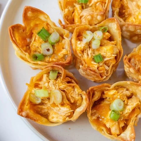 Golden-brown Buffalo Chicken Dip Pinwheel Wontons, a crispy appetizer with a spicy, creamy filling.