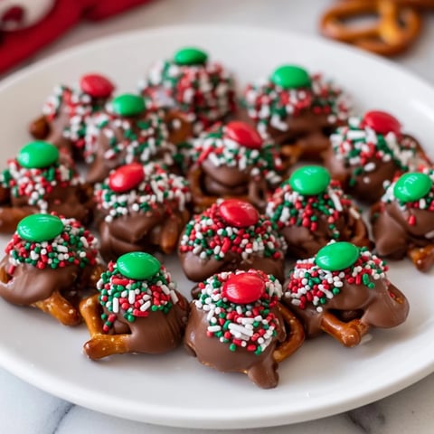 Warm, gooey Air Fryer Christmas Pretzel Bites with melting chocolate and festive sprinkles, ready to eat.