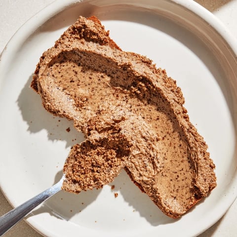 Quick Christmas Cookie Butter Spread swirled, creamy texture, ready to spread on toast; festive treat.