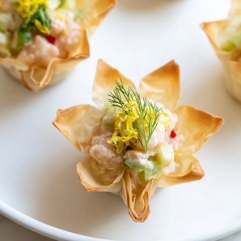 Golden, star-shaped Mini Star Cocktail Cups filled with savory shrimp salad, perfect party appetizers.