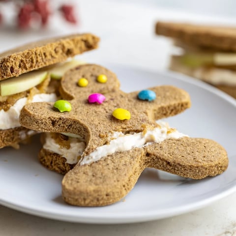 Gingerbread man sandwich cutouts with cheerful faces, offering a delightful kids' lunch treat.