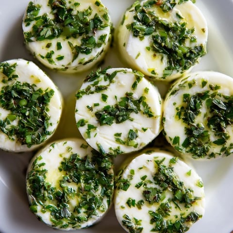 Vibrant cheese "Mossy Stones" appetizer, with herbs, ready for a cheese platter and friends.