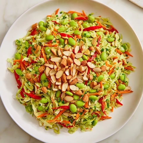 Crunchy Cabbage and Edamame Salad with vibrant colors and a creamy green dressing, ready to eat!