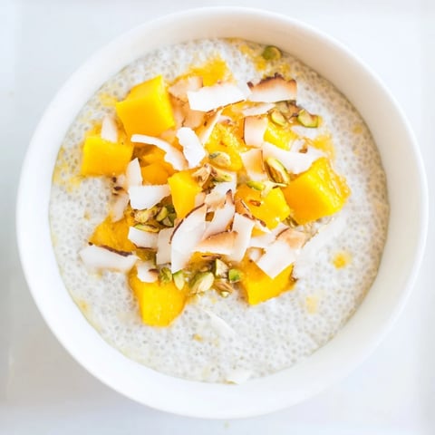 Creamy Mango Coconut Chia Pudding layered with fresh mango, a healthy and delicious breakfast.