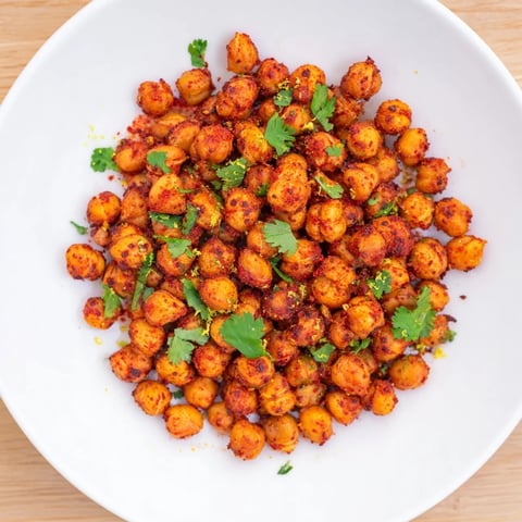 Golden and crispy Harissa Chickpea Roast, savory from spices, ready for a flavorful bite.