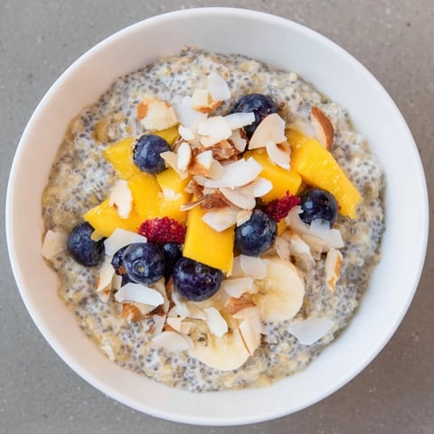 Creamy chia seed pudding, chilled overnight, topped with fresh berries, a healthy breakfast delight.