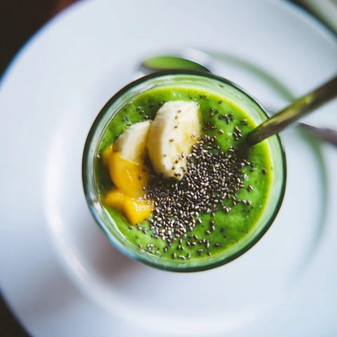 Creamy and vibrantly green spinach-hidden smoothie, a refreshing breakfast drink blended to perfection.
