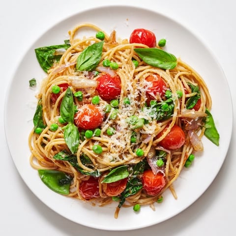 Fragrant Spring Veggie One-Pot Spaghetti, bright with tomatoes and basil, ready to serve and enjoy.