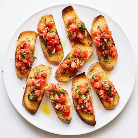 Freshly baked Bruschetta toasts, smelling of garlic and herbs, ready to be enjoyed as a starter.
