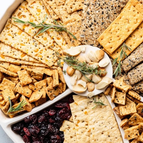 Festive Holiday Crackers arranged on a platter, ready for cheese and a delicious holiday appetizer.