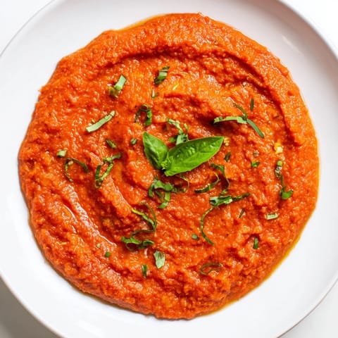 Rich, vibrant veggie-loaded tomato pasta sauce, ready to pour over steaming pasta, smells fantastic.