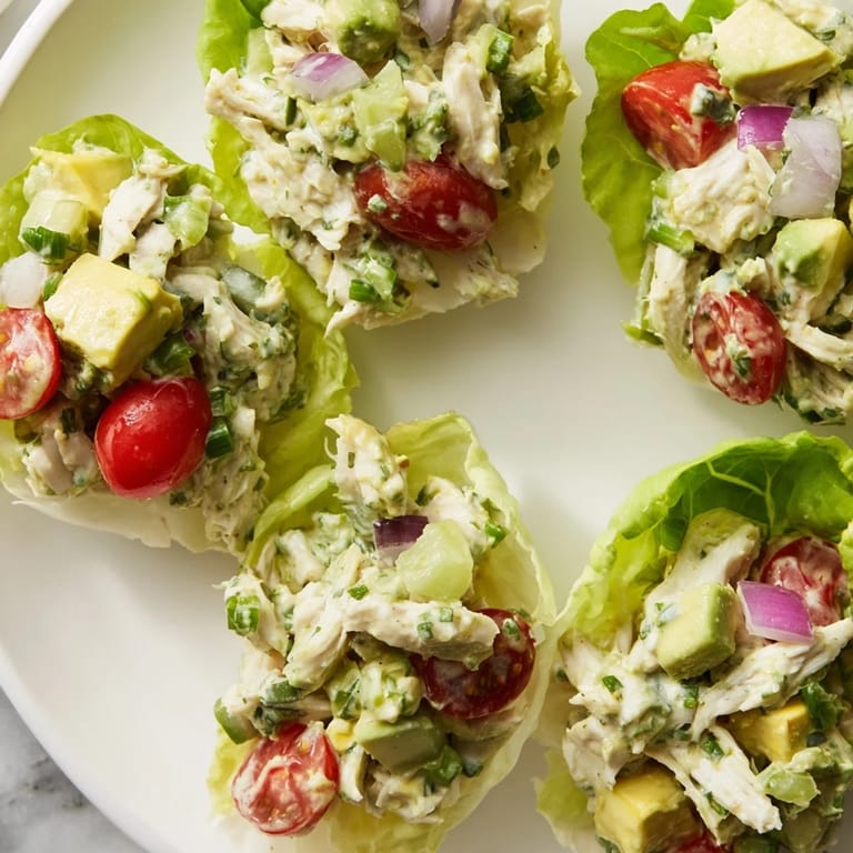 Zesty chicken salad made with avocado, served in crunchy lettuce wraps.