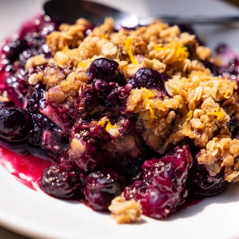 Delightful blueberry & lemon crisp cooling on the counter, ready to serve warm.  