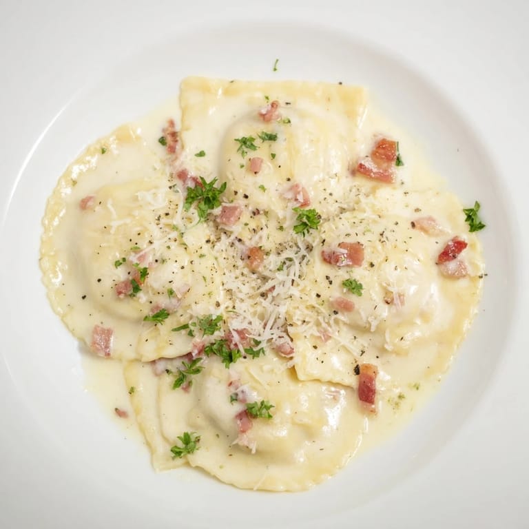 Golden-brown pancetta crisps atop a plate of rich Olive Garden Ravioli Carbonara, ready to be enjoyed.