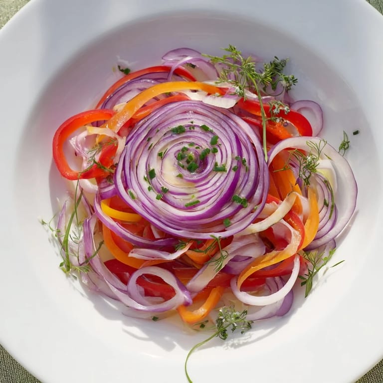 A visually appealing The Spinning Top salad, ready to eat, showcases crisp, wispy vegetables and aromatic herbs.