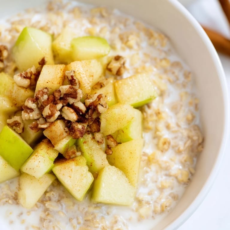 This cozy breakfast shows off a comforting apple pie oatmeal bowl, topped with caramelized apples.