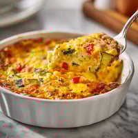 A white bowl filled with food.